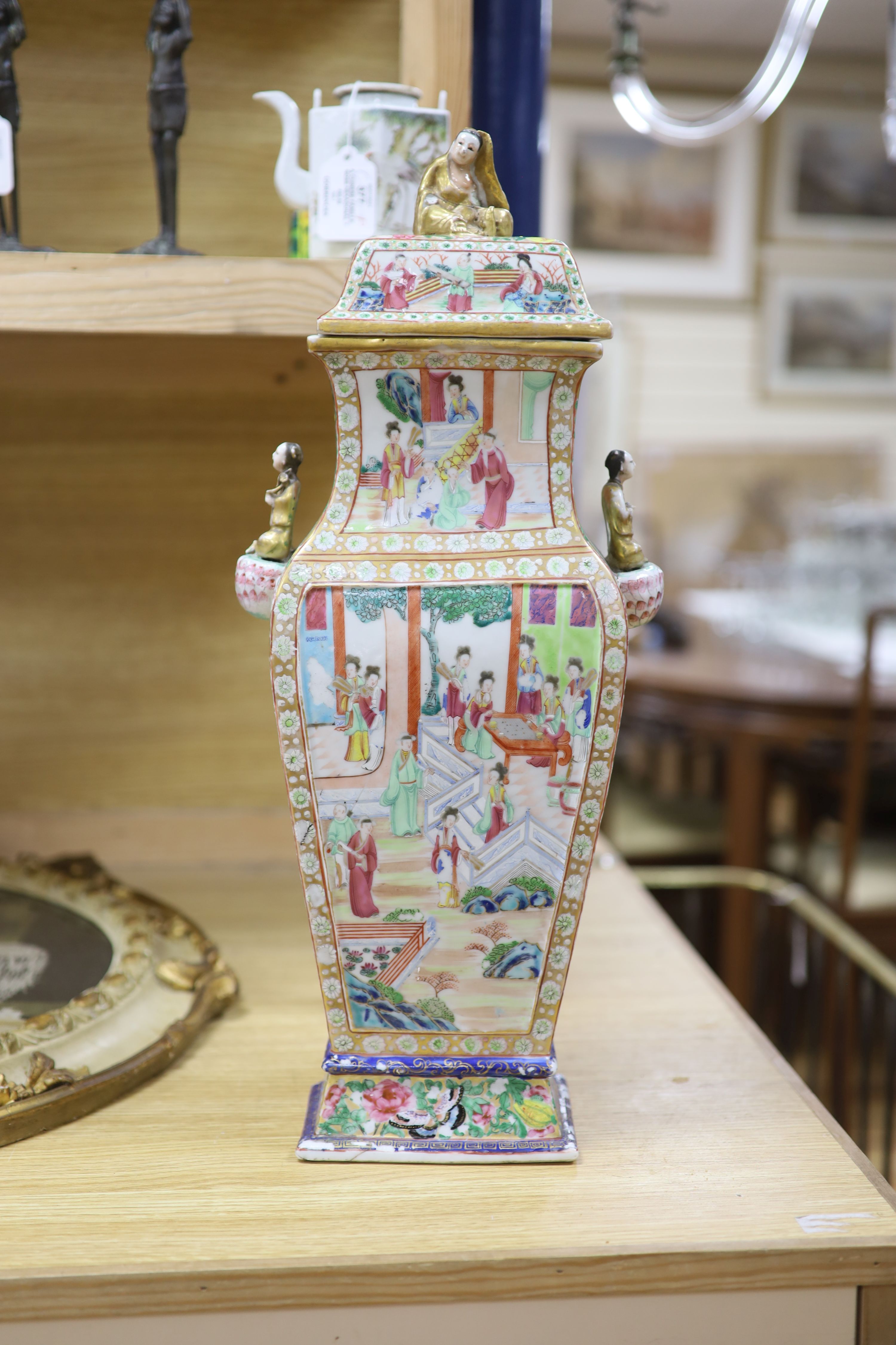 A large Chinese famille rose Canton decorated vase and cover, Daoguang period, height 53cm (a.f)